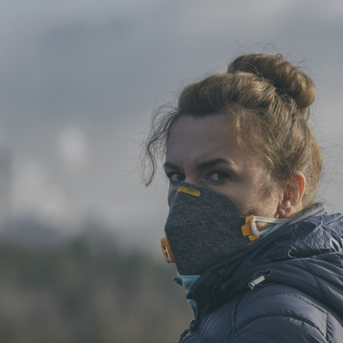 woman wearing mask due to air pollution