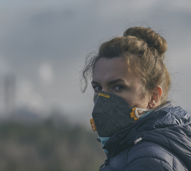 woman wearing mask due to air pollution